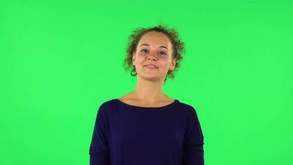 Portrait of Curly Woman Proud of Himself. Green Screen alt