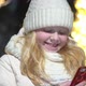 Beautiful Blonde Woman Chatting in a Smartphone on a Christmas Decorated Street in Winter - VideoHive Item for Sale