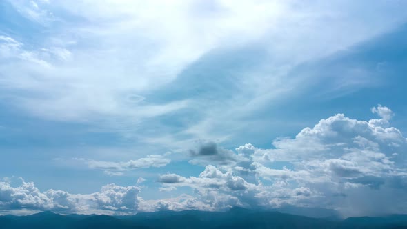 Aerial view of the blue sky with white clouds in summer day. alt