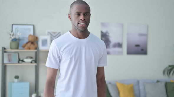 Close Up of Athletic African Man Doing Exercise with Dumbbells alt