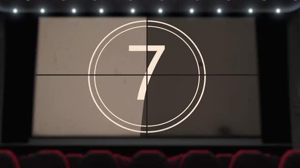 Film Countdown on the Cinema Screen in the Movie Theater Without Audience alt