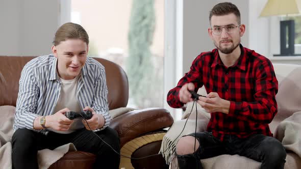 Young Caucasian Man in Eyeglasses Getting Upset Losing in Video Game and Leaving alt