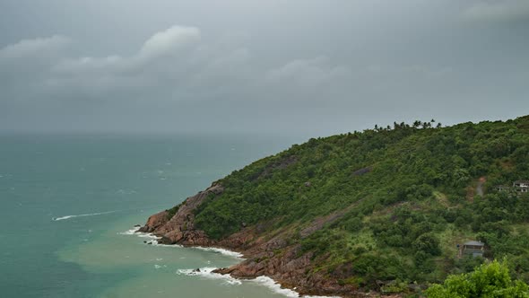 Dark Rainy Clouds Over Tropical Sea with Rock Mountain in Koh Phangan Island, Thailand alt
