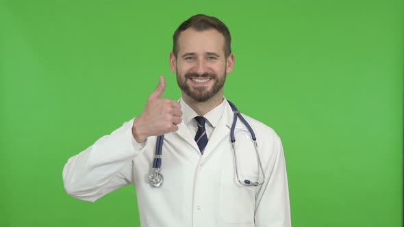 Cheerful Doctor Showing Thumbs Up Against Chroma Key alt