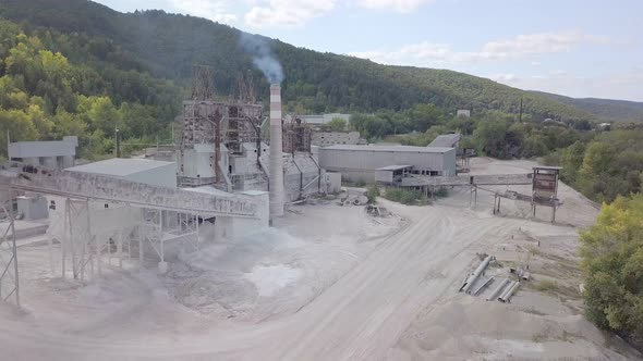 Aerial View on Buildings of Plant of Processing Limestone in Sunny Day