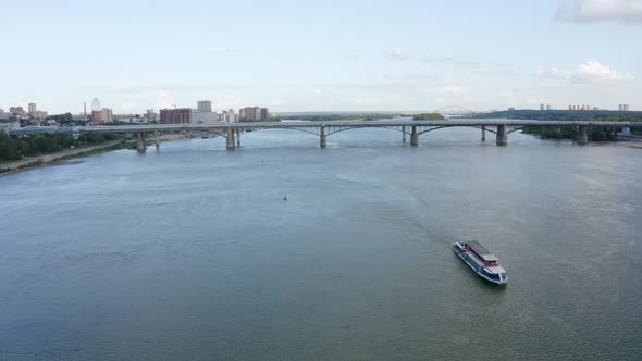 Bridge Over the Ob River and a Sailing Ship in Novosibirsk