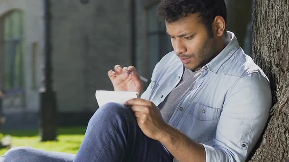 Inspired Biracial Student Recalling Formulas and Writing Them to Solve Equation alt