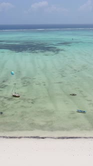 Tanzania  Vertical Video Kitesurfing Near the Shore of Zanzibar Slow Motion alt