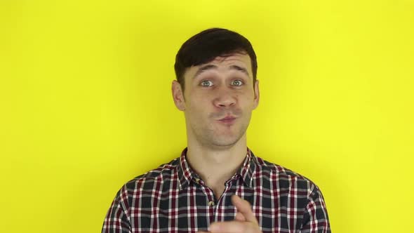 A Funny, Handsome Guy Claps His Hands Sarcastically. Portrait of a Young Guy, Shakes His Head alt