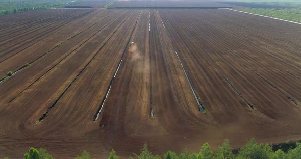 Peat Harvesting in Bog Peat Production Fields Aerial View alt