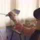 Asian Girl Painting on Canvas at Home - VideoHive Item for Sale
