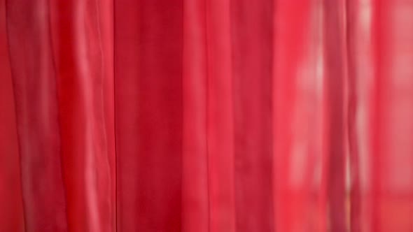 Chic and Elegant Texture of the Moving Folds of Light Red Fabric. Backdrop of Transparent Red Tulle
