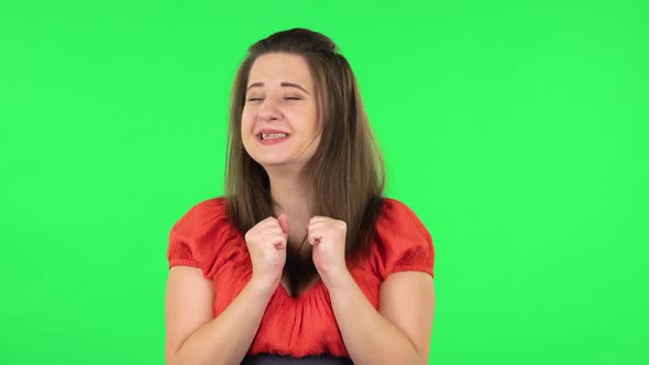 Portrait of Cute Girl Very Rejoicing, Clapping and Dancing. Green Screen alt