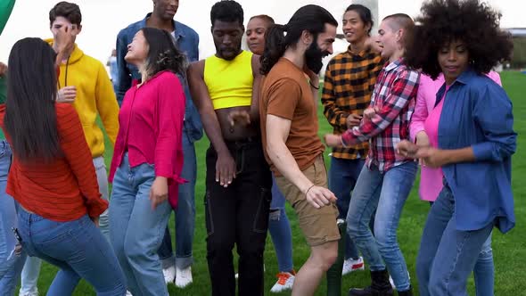 Happy multiracial people dancing outdoor