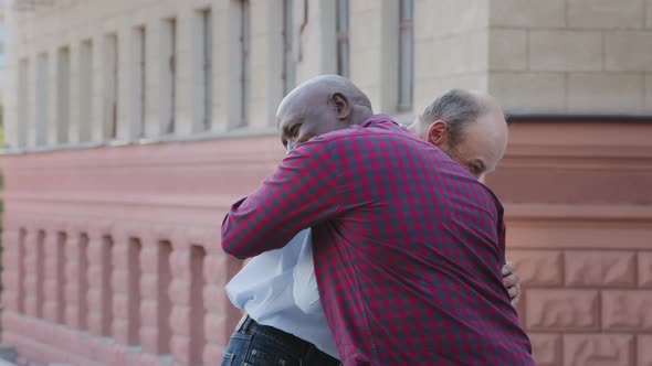 Two Happy Elderly People Mature Adult African American Man Cuddling Smiling Old Male Friend alt
