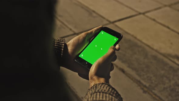 Man Using Chroma Key Smartphone While Standing Gesturing Swiping Scrolling alt