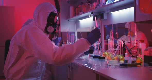Scientists Working in Laboratory in Red Light alt