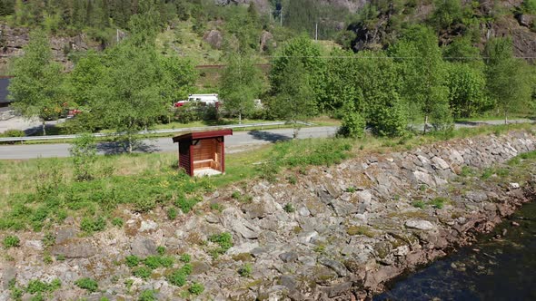 Small weather shelter made for salmon fishers along Norway salmon river at Dalekvam alt