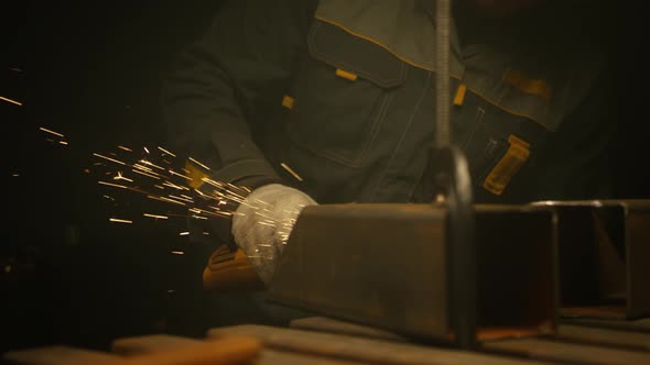 Worker grinding iron alt