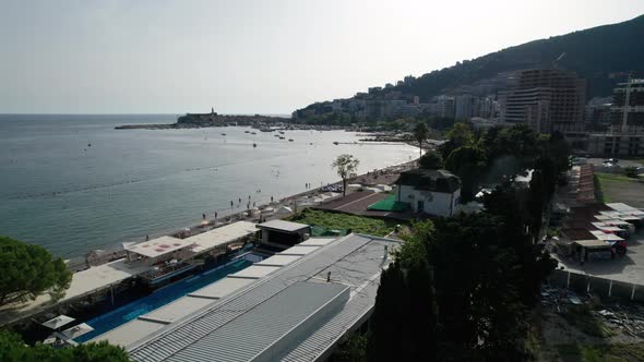 Aerial View Budva Beach By Sea with Sun Loungers and People Seashore Montenegro alt