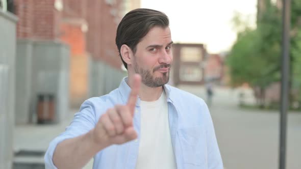 Man Showing No Sign By Finger Sign alt