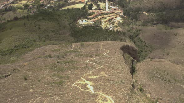Aerial shot of Villa de Leyva during Daytime. Tiltup 4k. alt