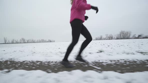 Side View Woman Running in Winter