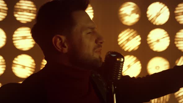 Fiery Showman Singing Song in Microphone Close Up alt