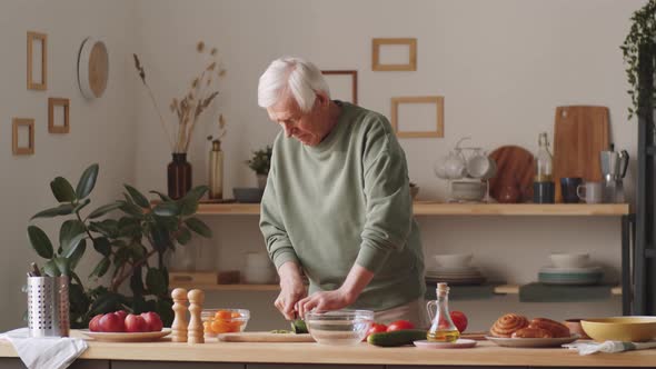 Senior Man Preparing Food at Home alt