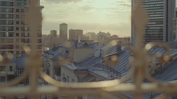 A Cinematic Shot of the City in the Rays of the Setting Sun alt