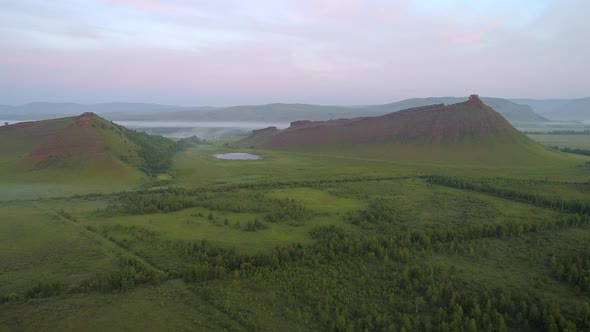 Flight to Red Mountain over Foggy Valley alt