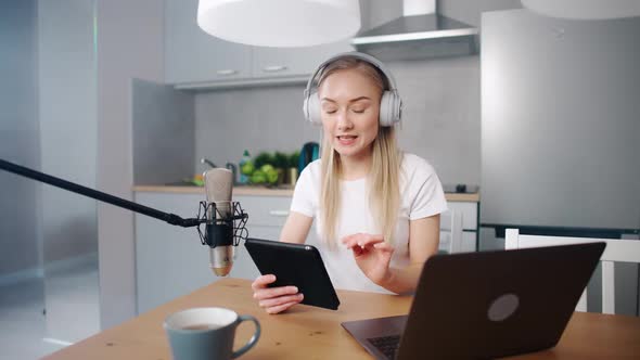 Female Streamer Makes a Live Podcast for Social Networks Remotely Working While Sitting in the alt