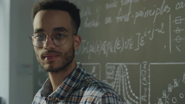 Portrait of Young College Student in Classroom alt
