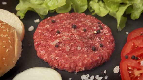 Fresh Beef for Burger on the Table with Lettuce Onion and Bread alt