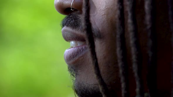 Young Man With African Locks Smiling Then Looking Serious Close Up Face Profile