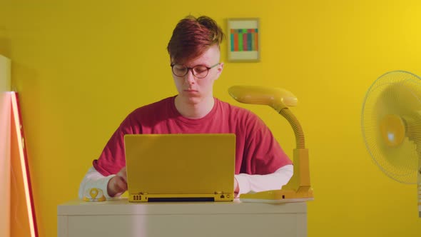 Freelancer Is Working On Yellow Laptop