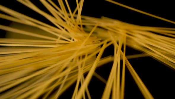Spaghetti falling very beautiful in a circle on a mirror surface in slow motion. alt