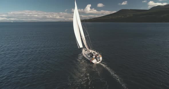 Luxury Yacht at Open Sea Racing Under Sails Aerial
