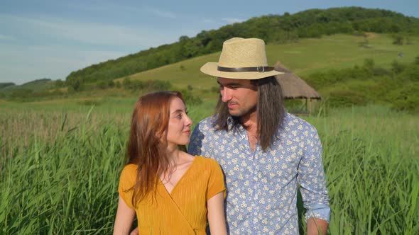 Young couple walking and talking alt