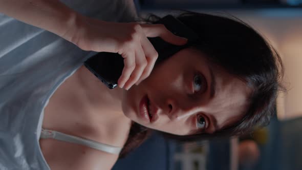 Vertical Video Stressed Alone Woman Talking at Phone Receving Tragic News alt