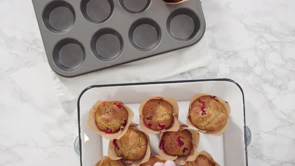 Flat lay. Step by step. Cooling freshly baked cranberry muffins. alt