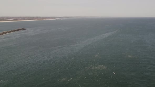 Aerial pullback from Atlantic ocean reveal Peniche fortress Landmark, Portugal