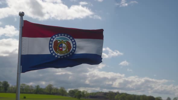 Flag of Missouri State Region of the United States Waving at Wind alt