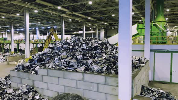 Piles of Trash in Recycling Center alt