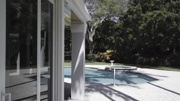 Walking Towards A Back Yard Pool alt