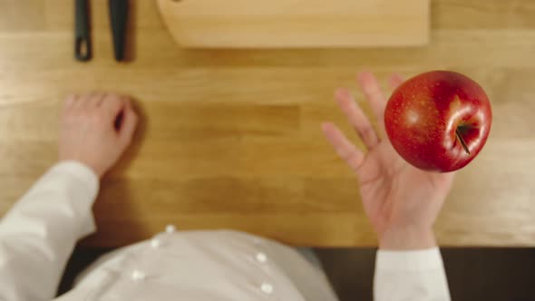 Cook Throws Up Red Apple And Catches It