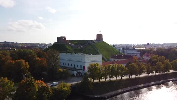 Gedimas castle tower and Vilnius cityscape on beautiful autumn time, aerial ascend view alt