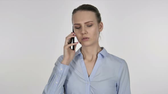 Young Businesswoman Talking on Smartphone with Customer alt