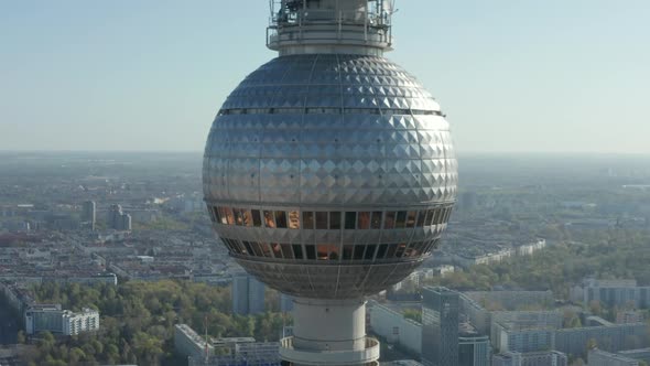 AERIAL: Super Close Up View of the Alexanderplatz TV Tower in Berlin, Germany on Hot Summer Day  alt