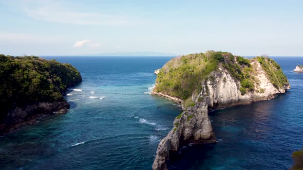 Fly Around Cliff and Rocks Over Ocean Along Coast alt